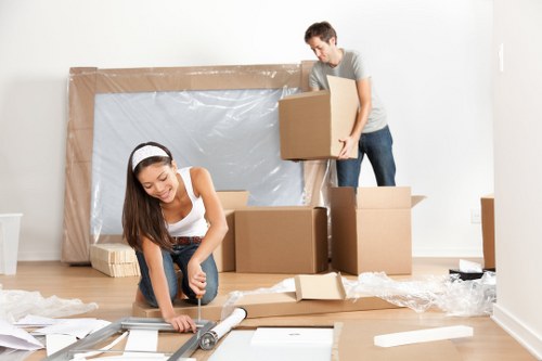 Removals team handling moving boxes in Richmond upon Thames