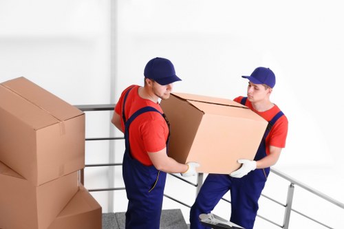 Moving van loading furniture in Richmond upon Thames residential street