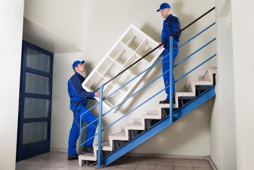 Local moving team handling furniture near a Richmond street