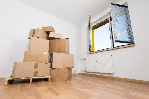 Removal van and packed boxes ready for a local home move